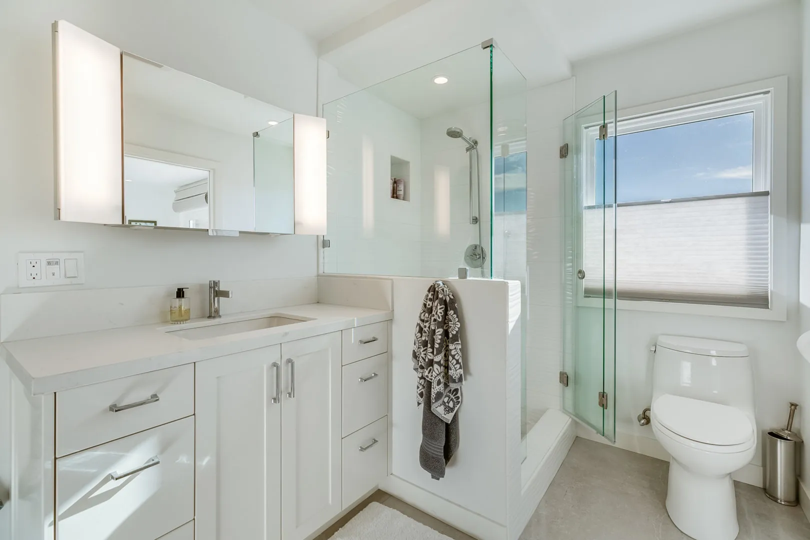 Coastal white bathroom remodel with walk-in shower