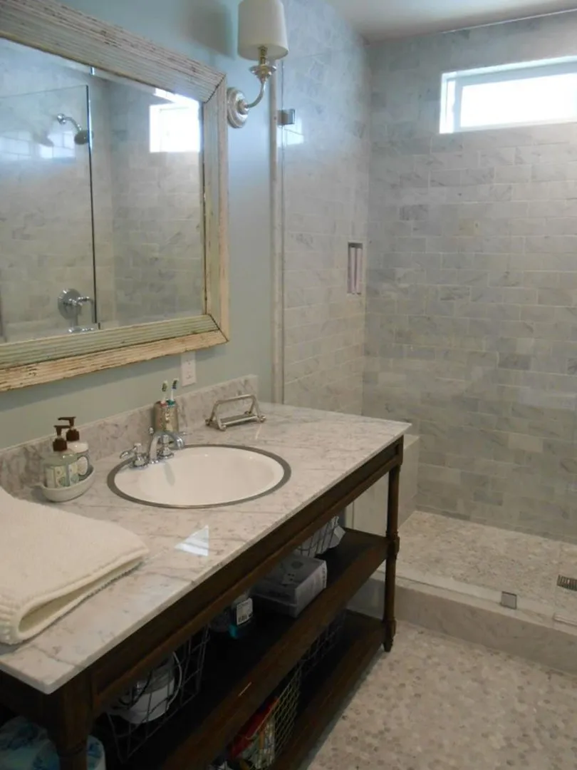Bathroom remodel with furniture-style wood vanity