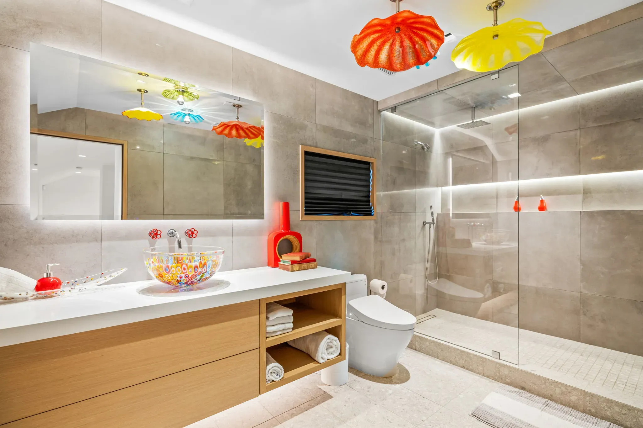 Walk-in shower with custom tile and integrated lighting