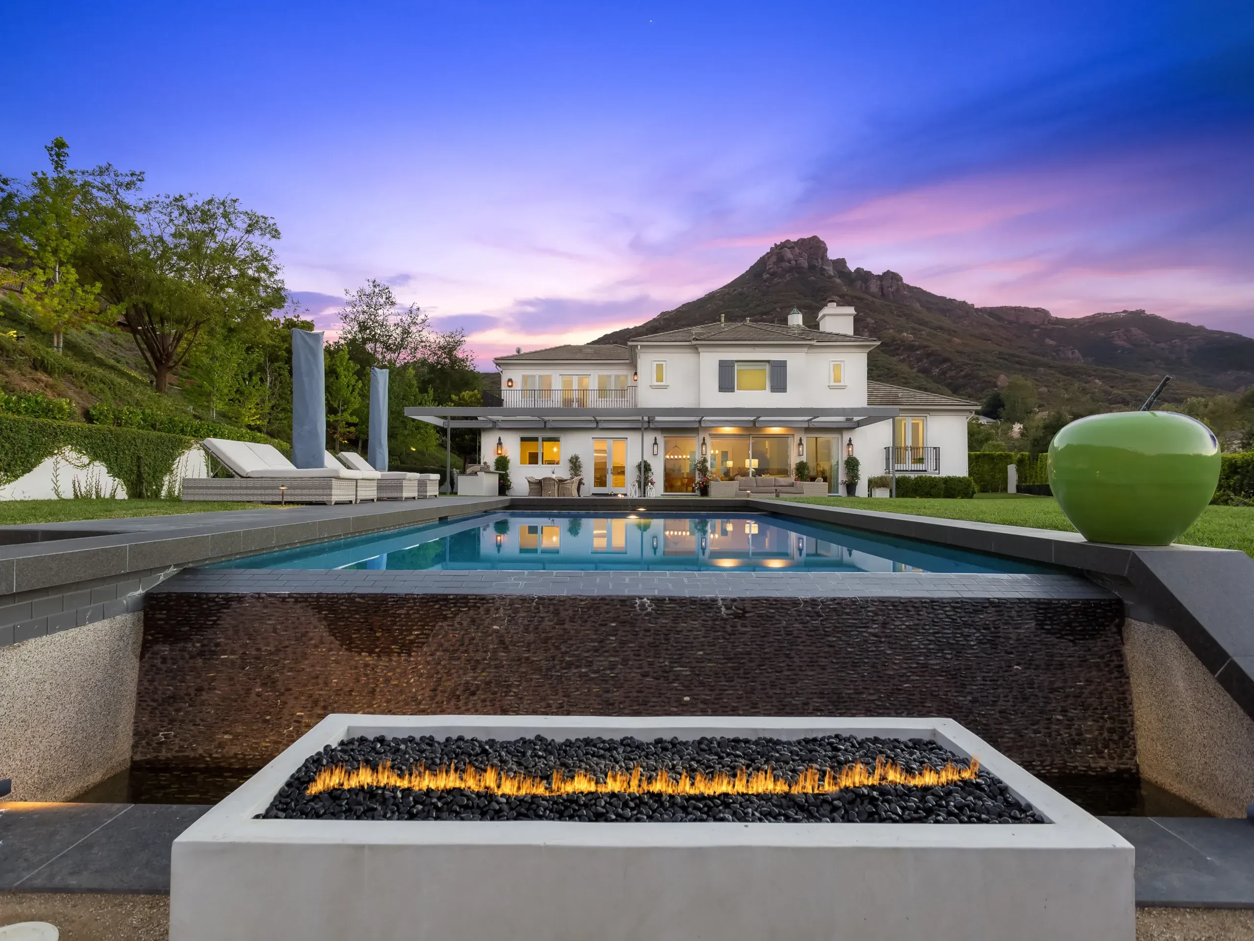 Custom outdoor firepit, pool, and stonework by Nicodemus Construction