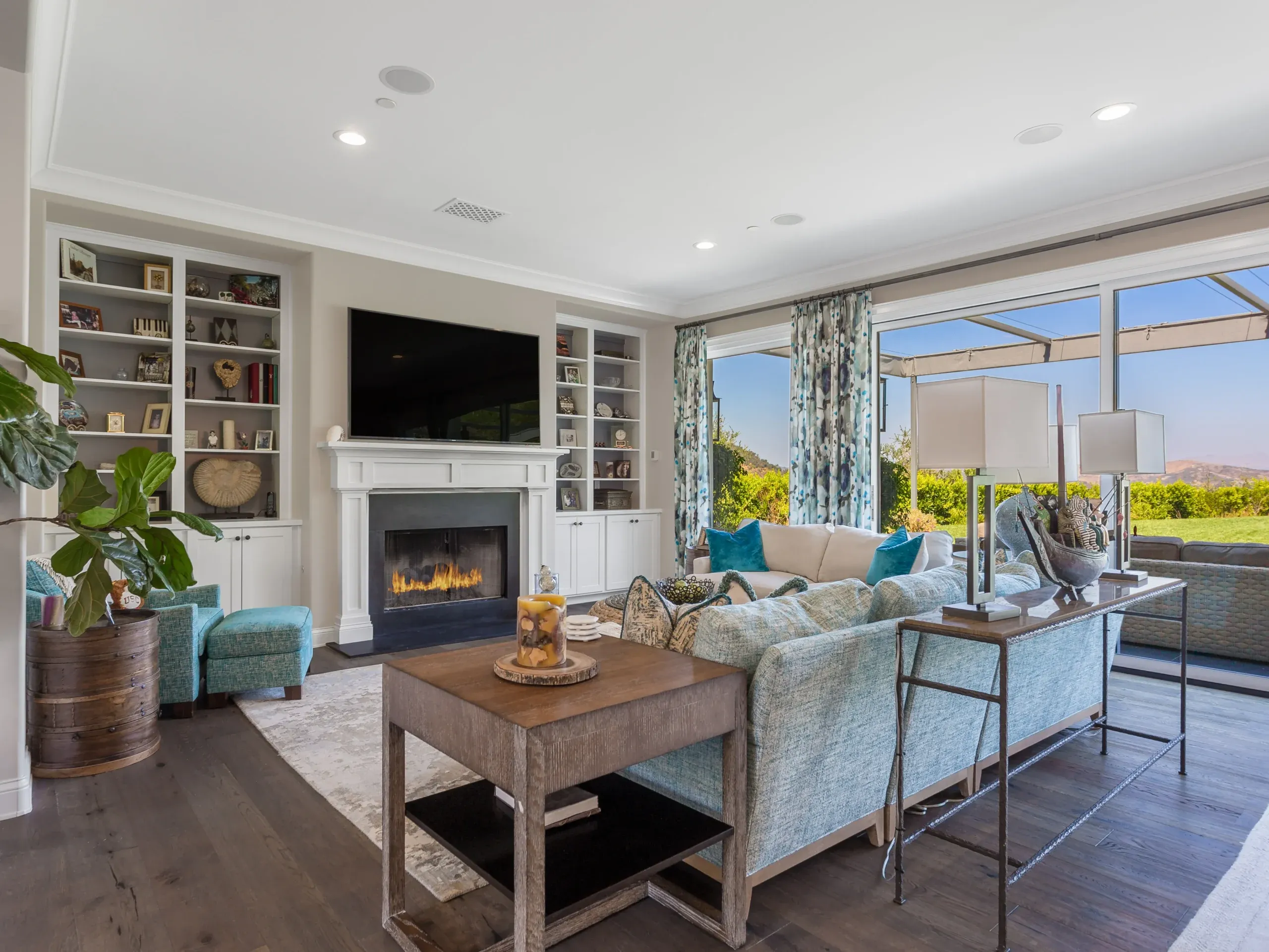 Family room with fireplace and built-ins at the Lake Sherwood home