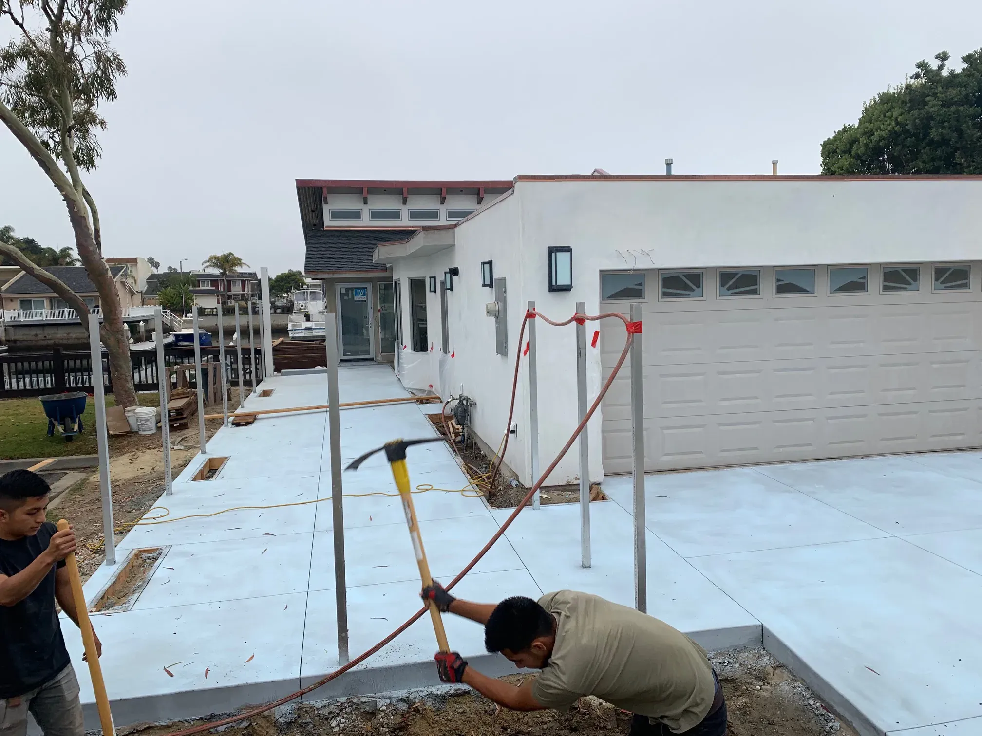 Concrete and site work at the front of the Mandalay home