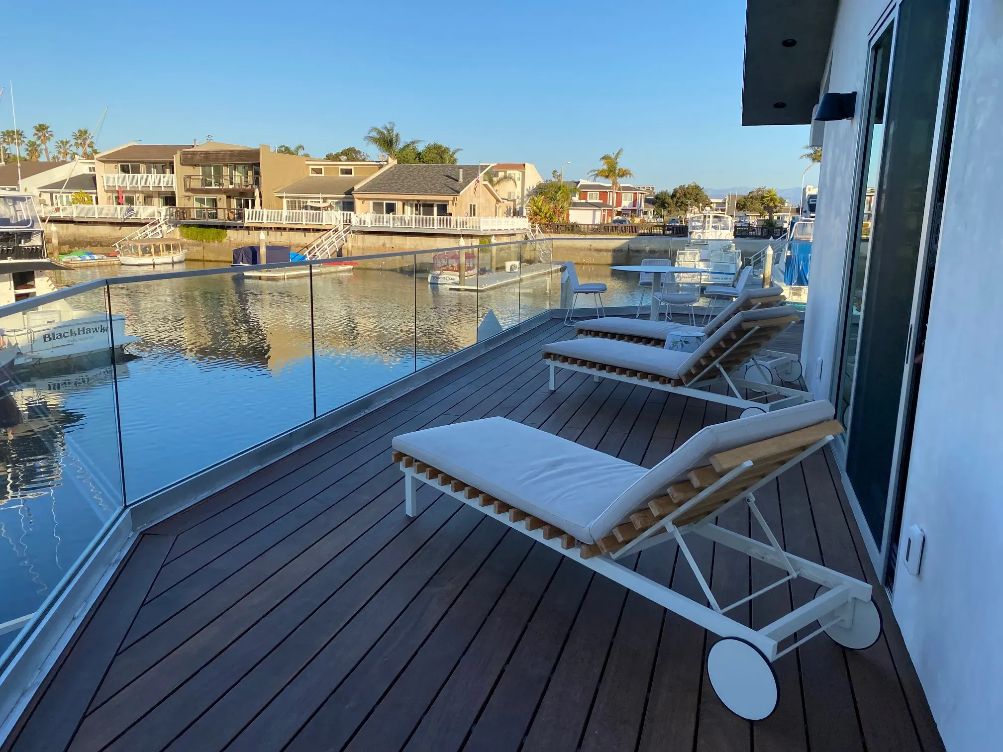 Finished side deck with lounge chair overlooking the canal