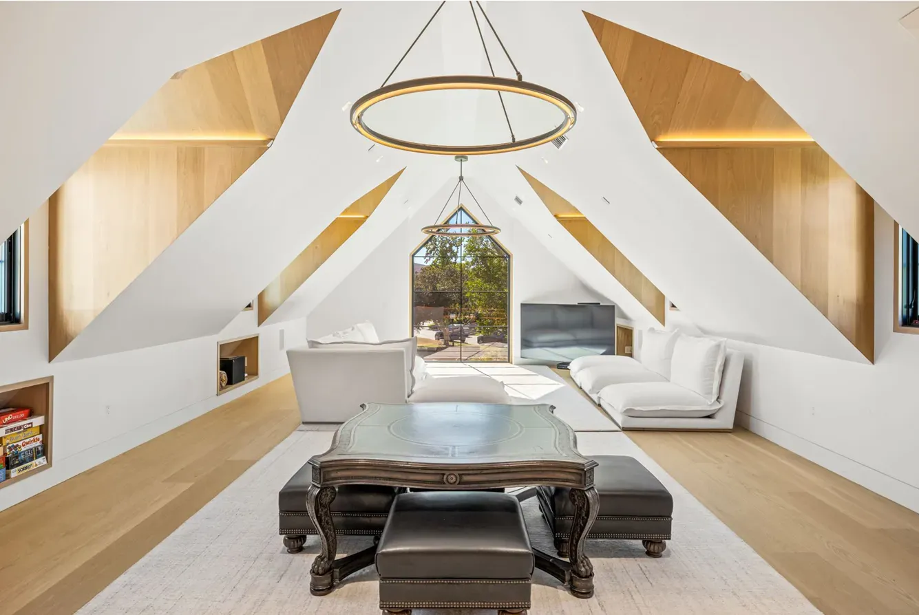 Finished media room addition with vaulted ceiling