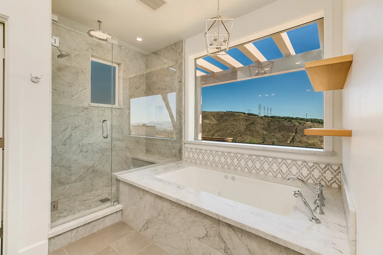 Primary bathroom with soaking tub and view window