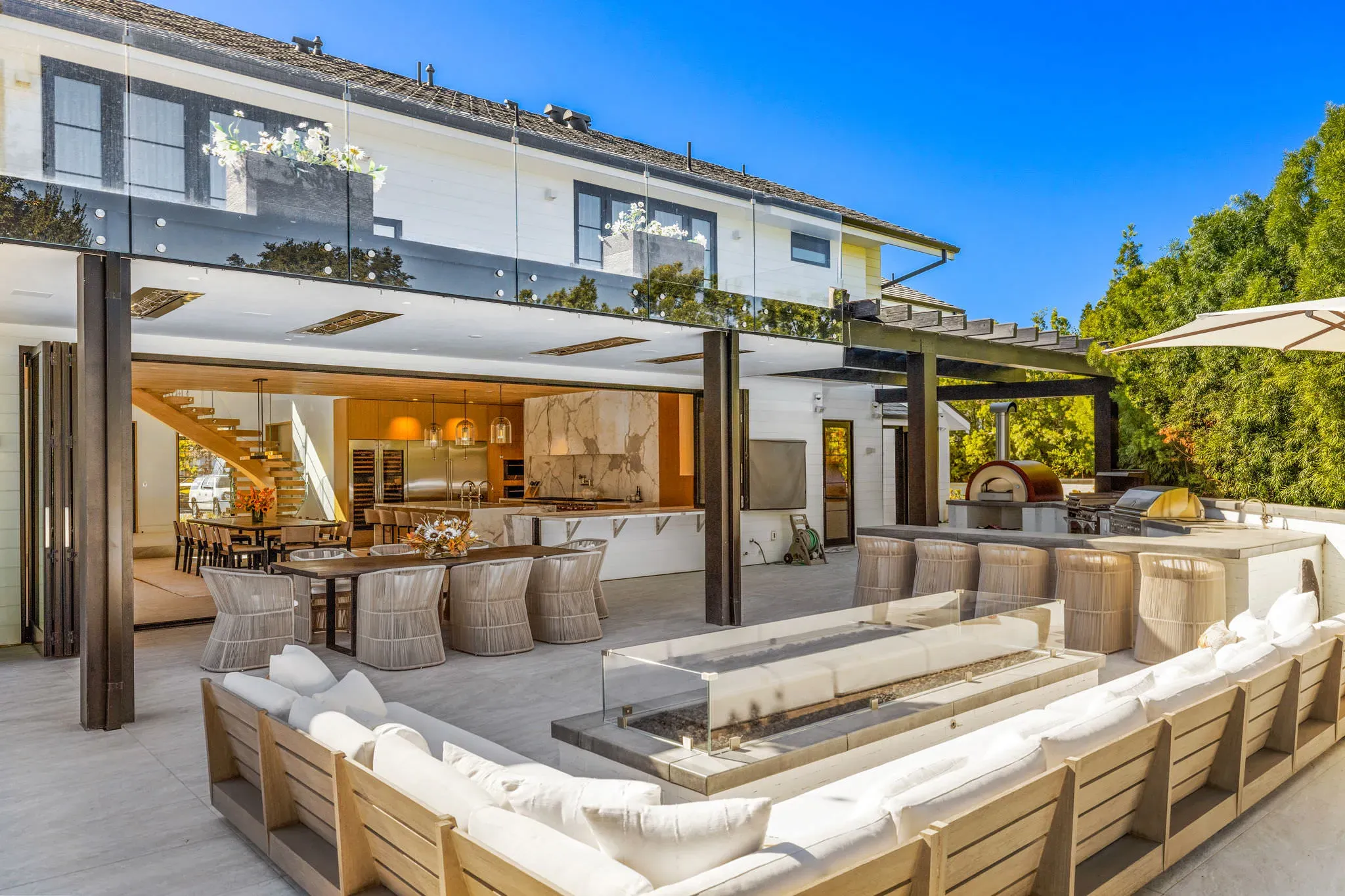 Covered outdoor living room with built-in seating, North Ranch