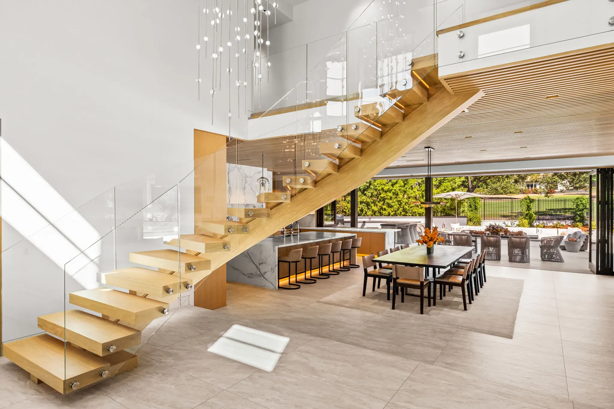 Floating white oak staircase with glass railing