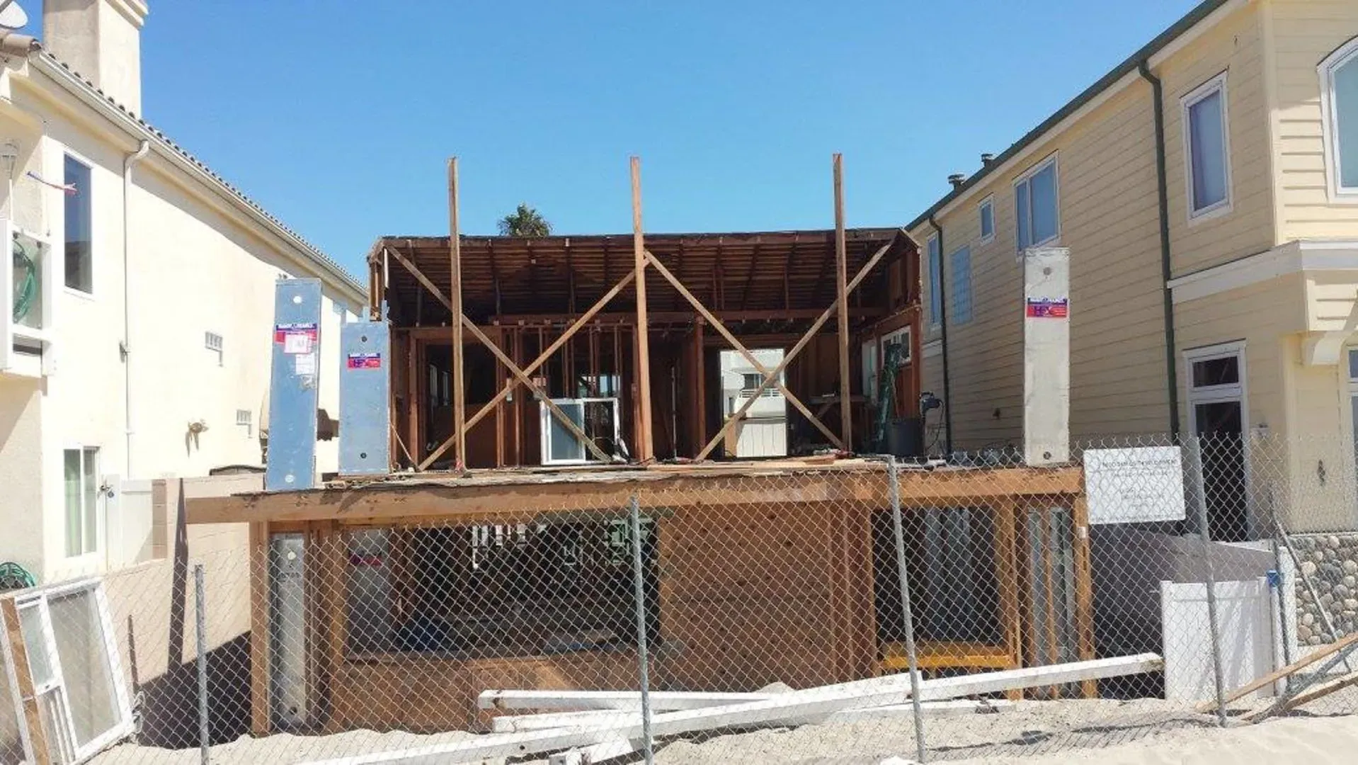 Rear framing rising behind the existing Silver Strand house